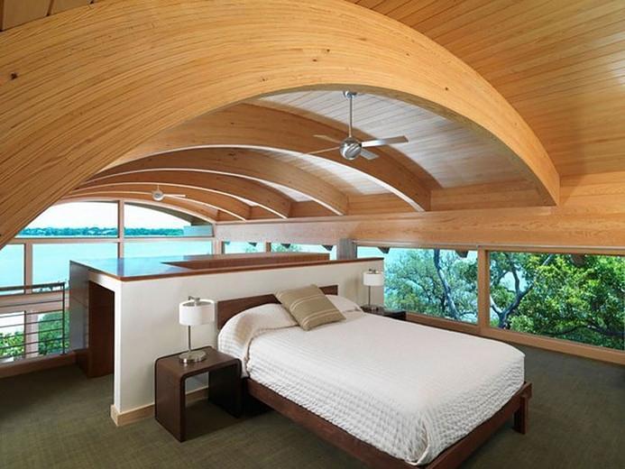 Camera da letto con curve in legno lamellare, di Prolegno
