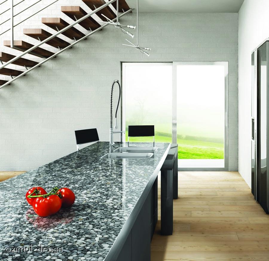 Ciottoli di fiume grigi e resina come piano di lavoro e rivestimento tavolo in cucina di Azimut Design
