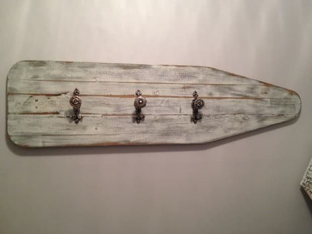 Clothes hanger with recycled ironing board, from Pinterest 