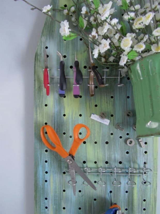 Ironing board organizer, from therehaboutique.blogspot.com 