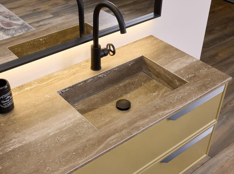 Top in pietra con lavabo integrato - foto diotti.com