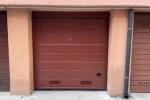 Sostituire la porta garage in condominio - foto officine locati