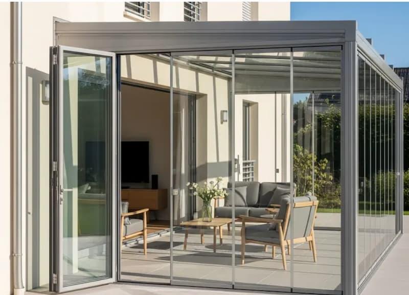 Chiusura della veranda e continuità con il soggiorno - foto infissi de.ma