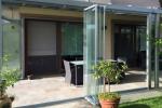 Veranda chiusa con vetrate a pacchetto - foto za za design
