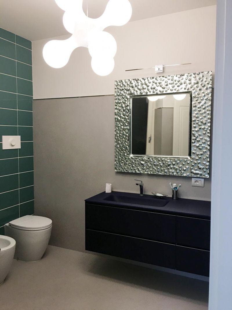 Ristrutturazione di un bagno: resina decorativa protagonista di pavimenti e rivestimenti 6